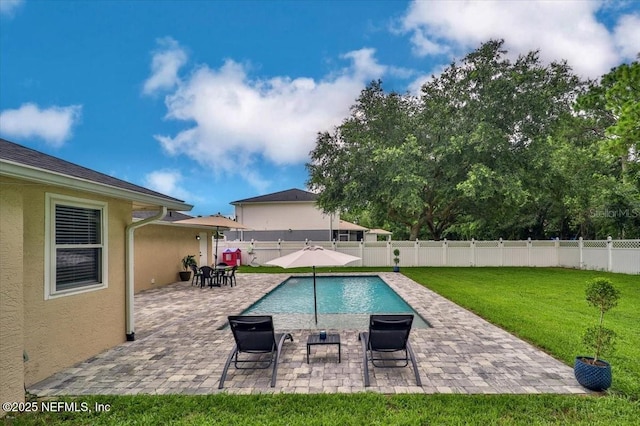 view of pool featuring a yard, a fenced in pool, a fenced backyard, and a patio area