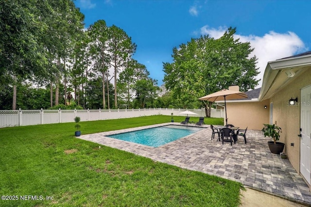 view of pool with a patio, a lawn, a fenced in pool, and a fenced backyard