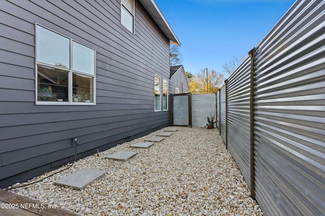 view of property exterior with fence