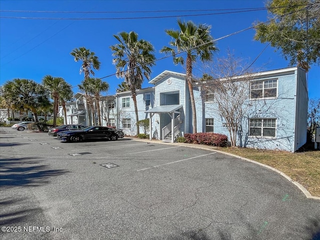 view of property with uncovered parking