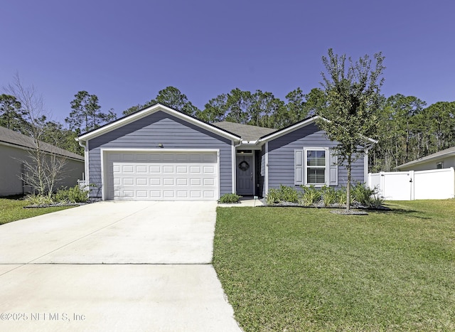 ranch-style house with driveway, an attached garage, a front yard, and fence