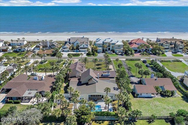 bird's eye view with a beach view, a residential view, and a water view