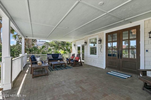 view of patio with french doors and an outdoor hangout area