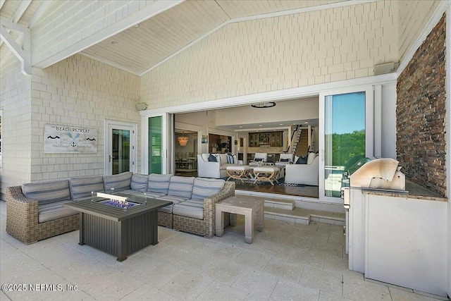 view of patio / terrace featuring outdoor lounge area and an outdoor kitchen