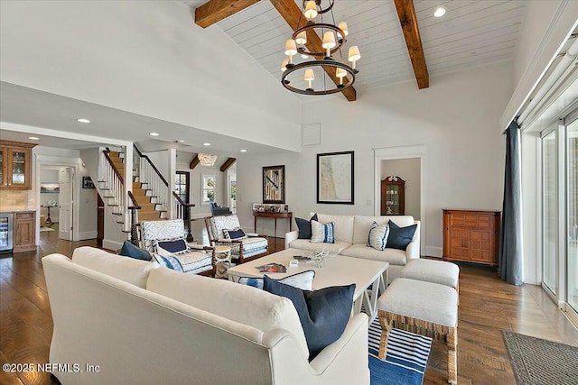 living area featuring high vaulted ceiling, dark wood finished floors, an inviting chandelier, stairs, and beamed ceiling