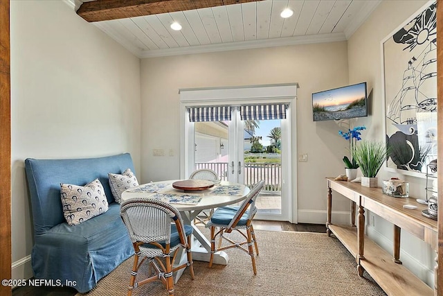 dining space featuring wood finished floors, recessed lighting, wooden ceiling, crown molding, and baseboards