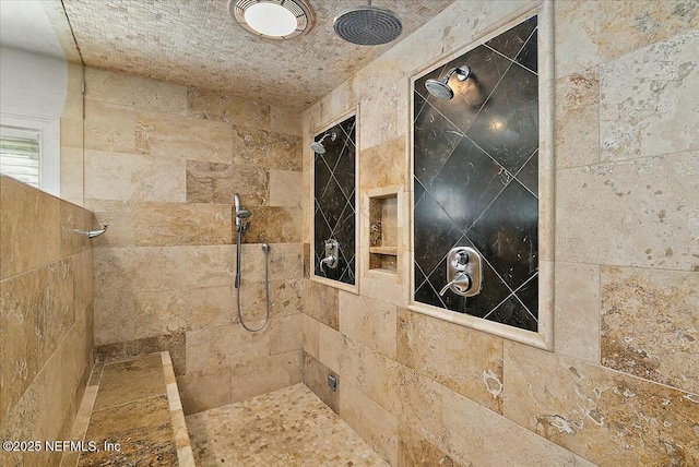 bathroom with tiled shower