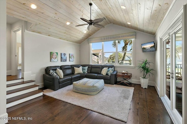 living room with a ceiling fan, vaulted ceiling, dark wood-style floors, and a wealth of natural light