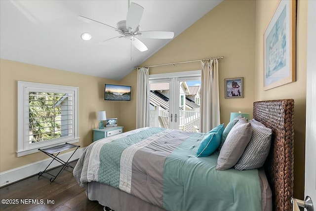 bedroom featuring access to exterior, multiple windows, and vaulted ceiling