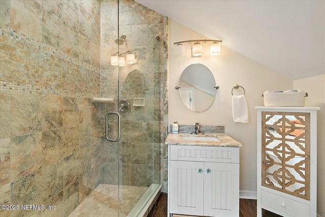 full bath featuring a stall shower and vanity