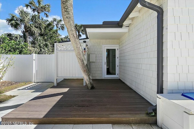 deck featuring a gate and fence