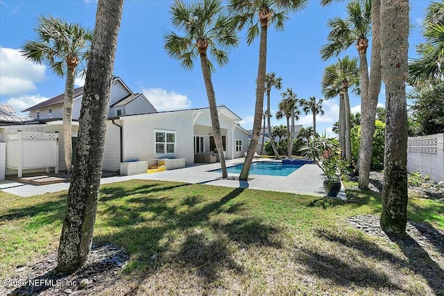 view of swimming pool with a patio area, a lawn, a fenced backyard, and a fenced in pool