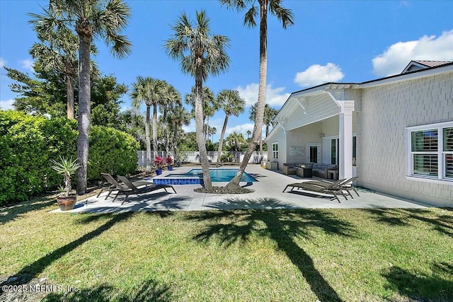 view of swimming pool featuring a fenced backyard, a yard, a patio, and a fenced in pool