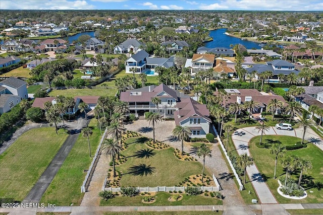 bird's eye view featuring a residential view and a water view