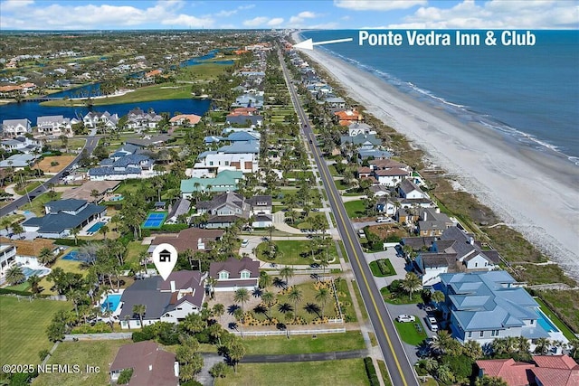 birds eye view of property with a residential view, a beach view, and a water view