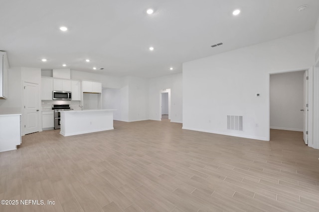 251 Pinzon Pl, Saint Augustine, FL 32095 - unfurnished living room featuring recessed lighting and light wood-type flooring