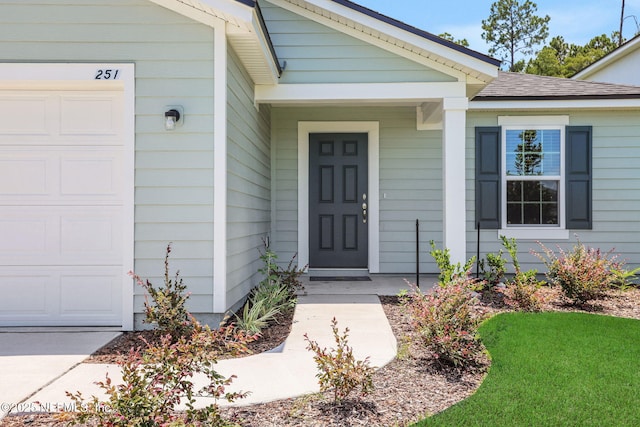 251 Pinzon Pl, Saint Augustine, FL 32095 - entrance to property with a garage and roof with shingles