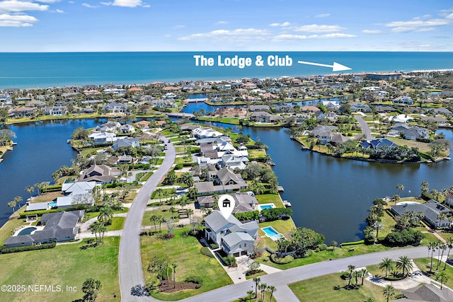 bird's eye view with a water view and a residential view