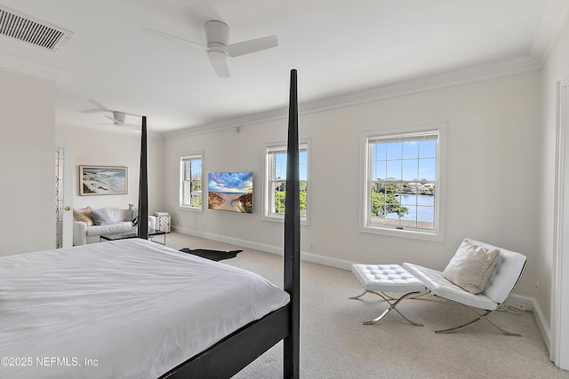 carpeted bedroom with baseboards, visible vents, and ornamental molding