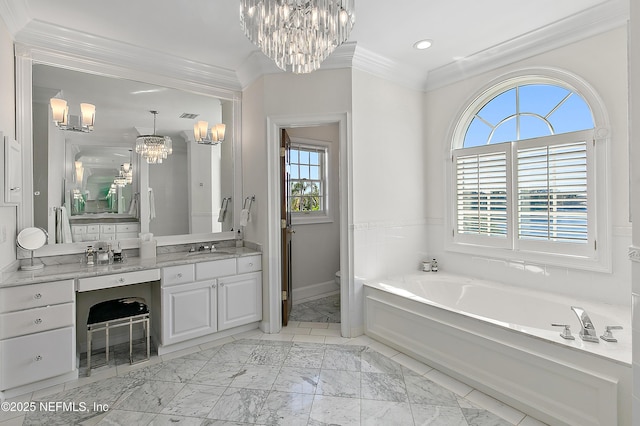 full bathroom with a notable chandelier, marble finish floor, crown molding, a bath, and vanity