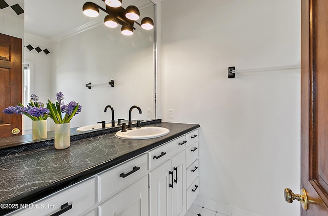 bathroom featuring vanity and crown molding