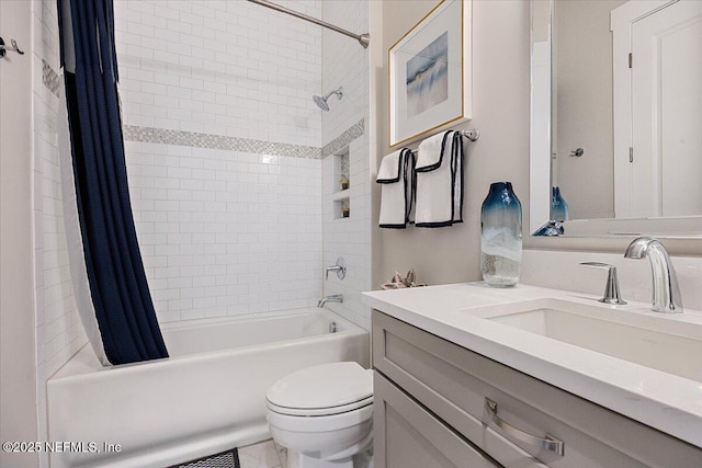 bathroom featuring toilet, vanity, and shower / bathtub combination with curtain