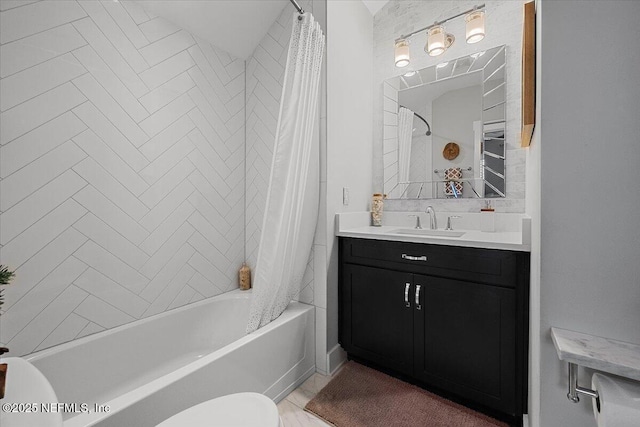 full bath featuring vanity, toilet, and shower / bathtub combination with curtain