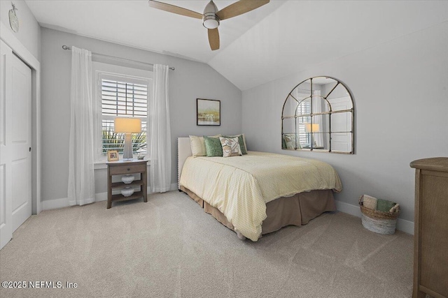 bedroom with ceiling fan, baseboards, lofted ceiling, and carpet floors