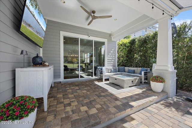 view of patio / terrace featuring a fire pit and a ceiling fan