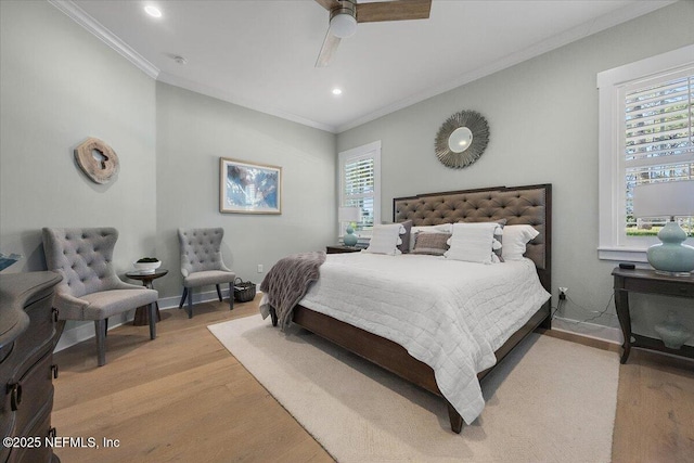 bedroom with light wood-type flooring, baseboards, and ornamental molding