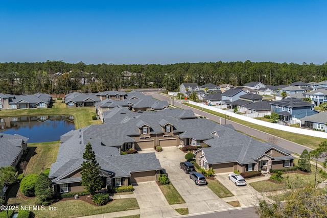 aerial view featuring a residential view and a water view