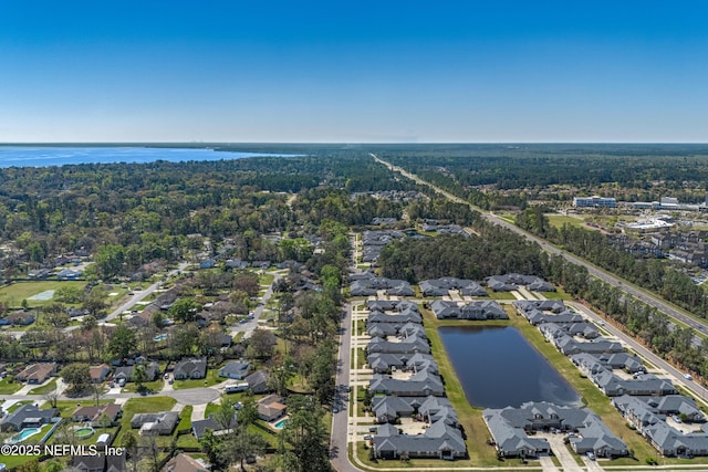 bird's eye view with a residential view and a water view