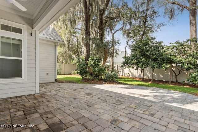 view of patio / terrace featuring a fenced backyard and a ceiling fan