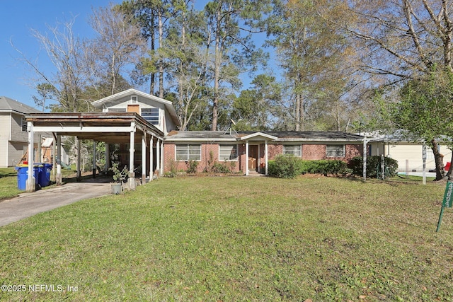 view of front facade with a front lawn, brick siding, and driveway