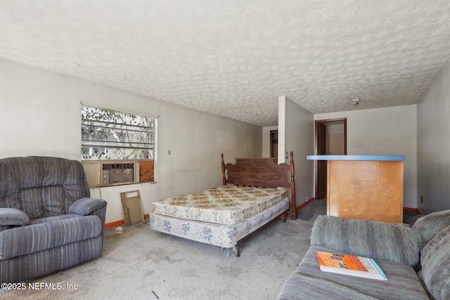 carpeted bedroom featuring cooling unit, baseboards, and a textured ceiling