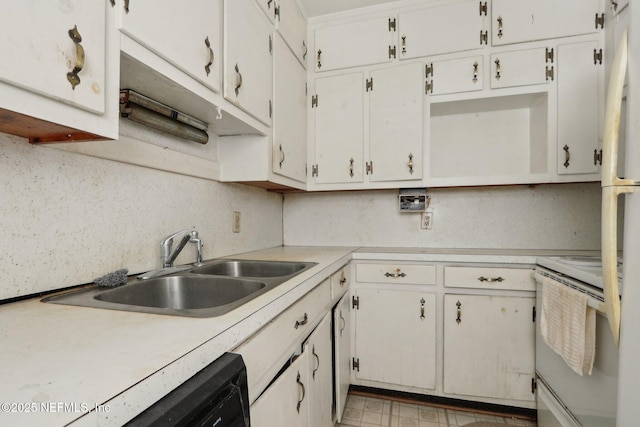 kitchen with white cabinets, white electric stove, light countertops, and a sink