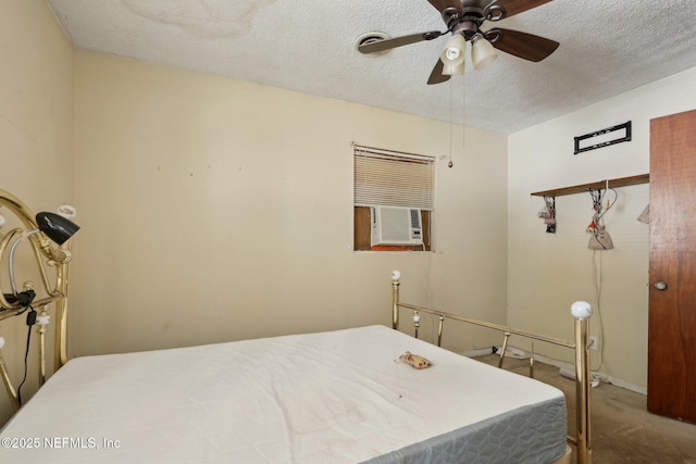 bedroom with a textured ceiling and ceiling fan