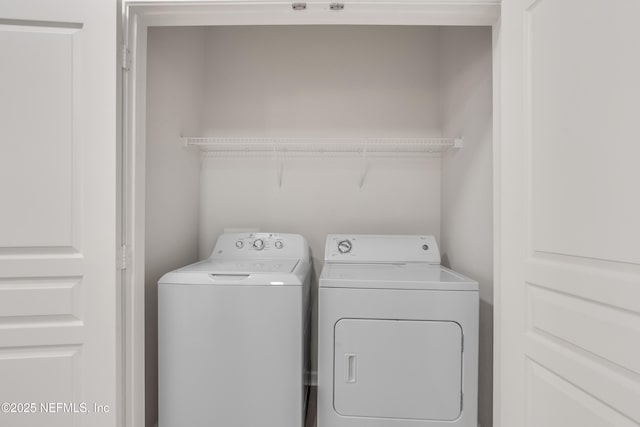 washroom with laundry area and separate washer and dryer