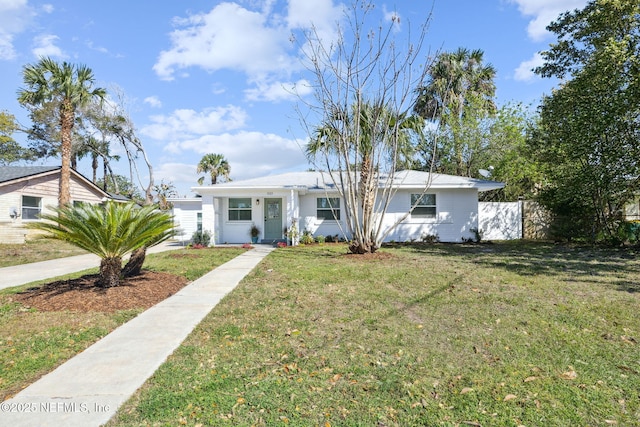 single story home featuring a front lawn and fence