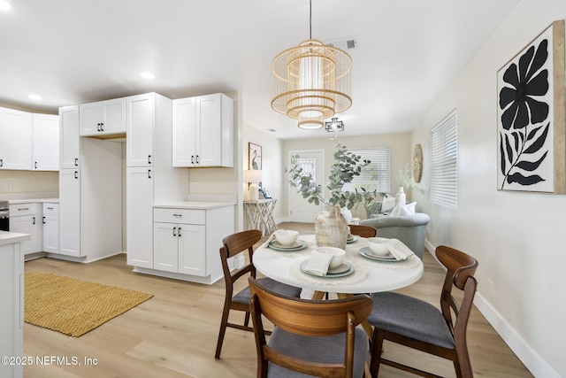 dining room with visible vents, baseboards, light wood-type flooring, recessed lighting, and a notable chandelier