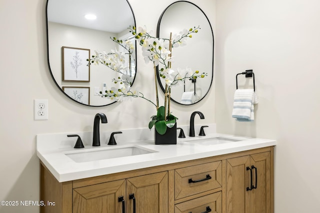 bathroom with double vanity and a sink