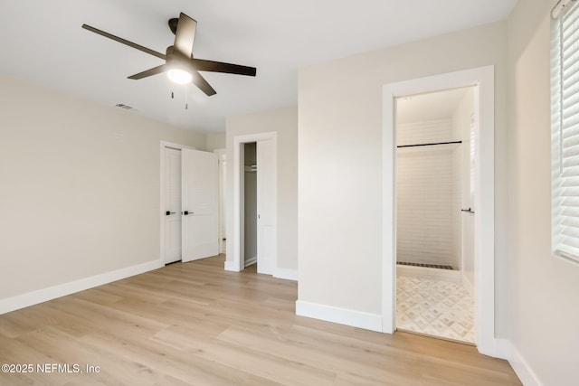 unfurnished bedroom featuring visible vents, light wood-style flooring, and baseboards