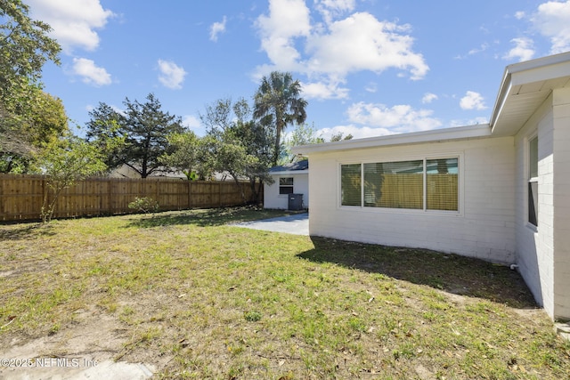 view of yard with a patio and fence