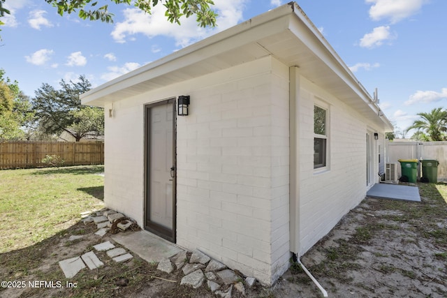 view of outdoor structure featuring an outbuilding and fence