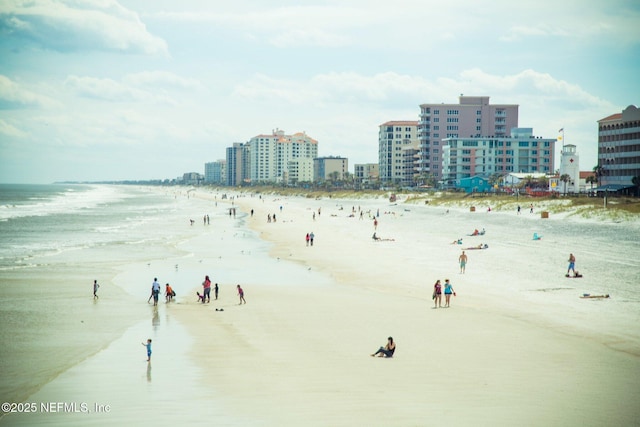 exterior space featuring a view of city and a beach view