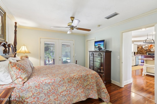 bedroom with visible vents, crown molding, dark wood-type flooring, french doors, and access to outside