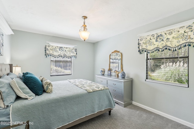 carpeted bedroom featuring baseboards