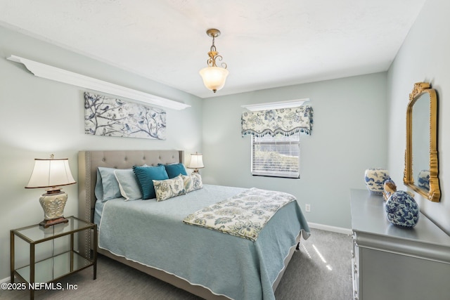 bedroom with baseboards and carpet floors