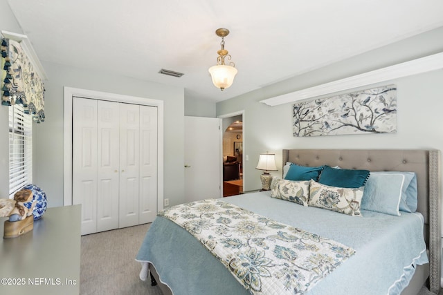 bedroom with visible vents and a closet