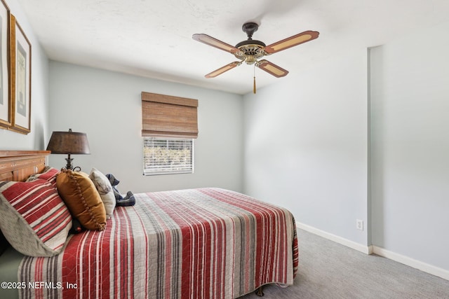 bedroom featuring baseboards, carpet floors, and a ceiling fan